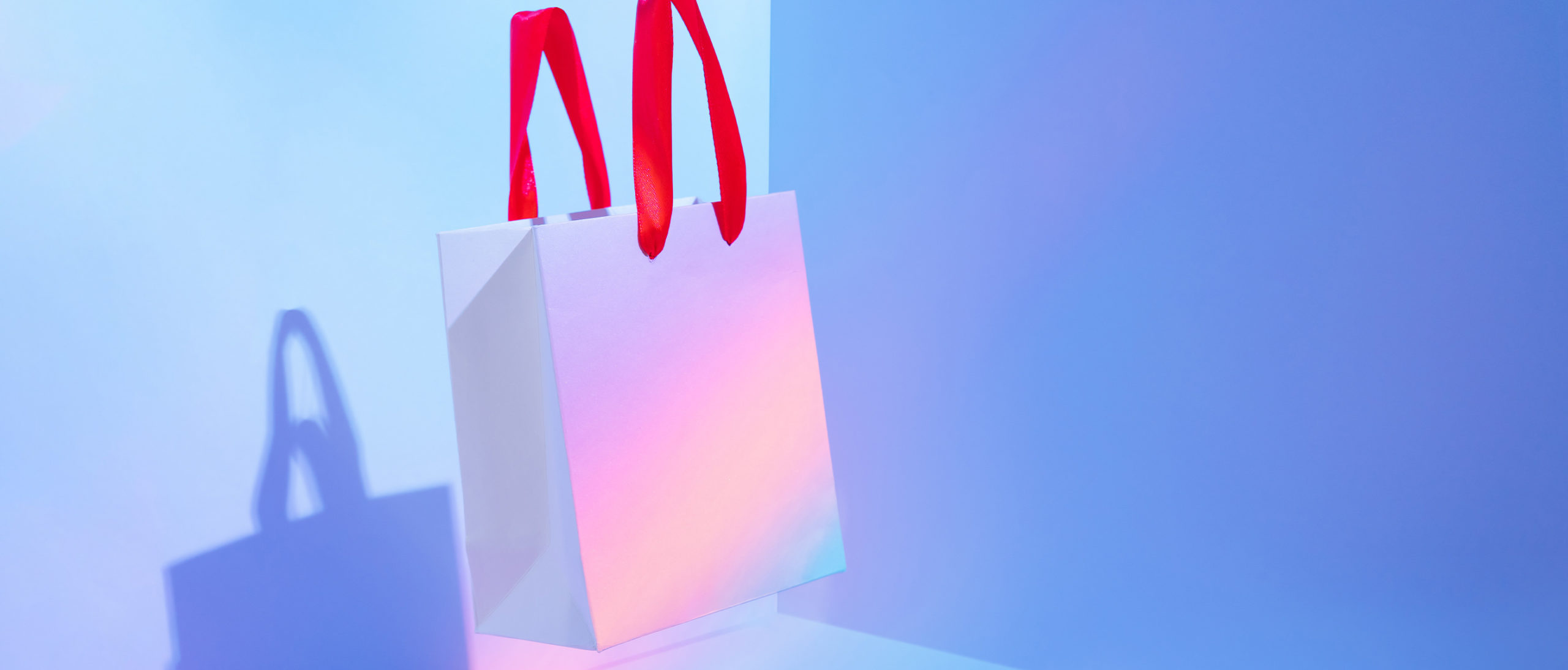 White paper shopping gift bag on chrome background